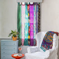 Colorful Rainbow Oasis upcycled sari curtains by Darn Good Yarn, boho home decor with eco-friendly recycled yarn.