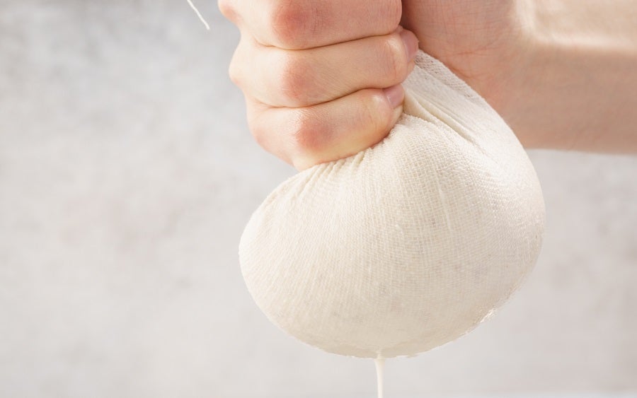 Reusable organic cotton cheesecloth for kitchen and dining, shown in a natural close-up image.