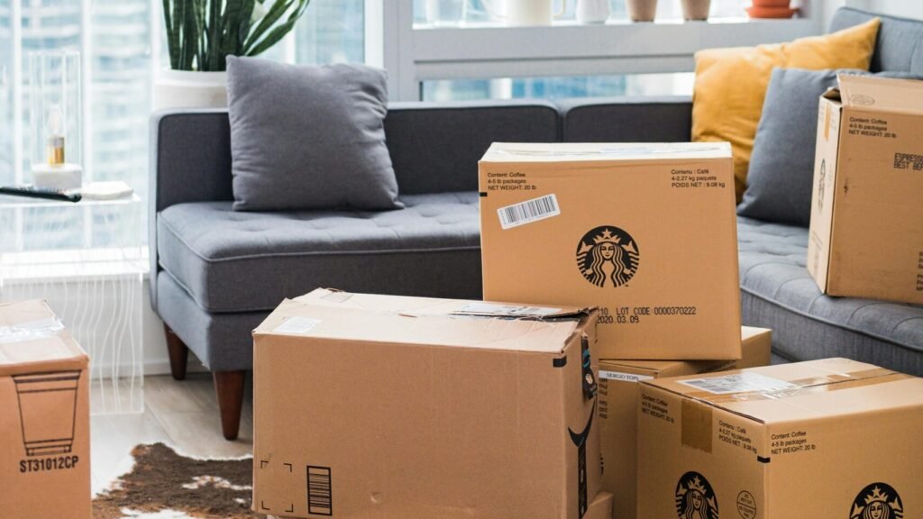 Bright city apartment interior with boxes shows moving day setup.